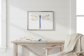 Pressed flower dragonfly with a gold frame on a white background