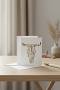 Greeting card with floral design on a white envelope