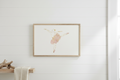 Framed artwork of a delicate floral design on a white background